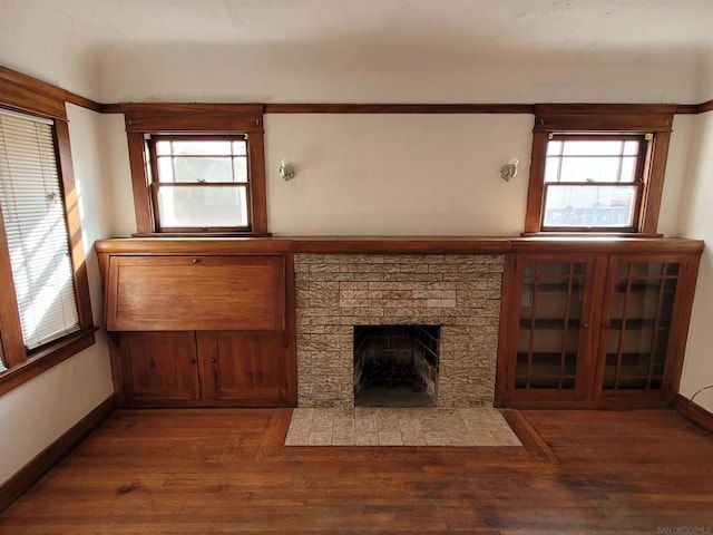 unfurnished living room with dark hardwood / wood-style floors