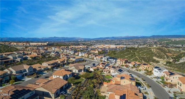 birds eye view of property with a mountain view