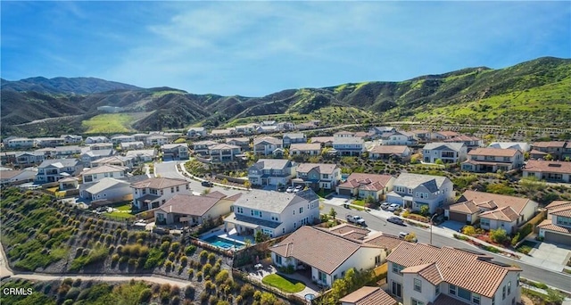 drone / aerial view featuring a mountain view