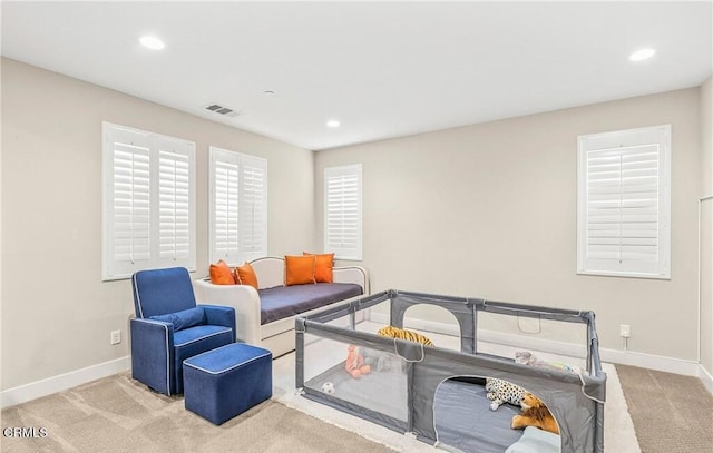 living room featuring light colored carpet