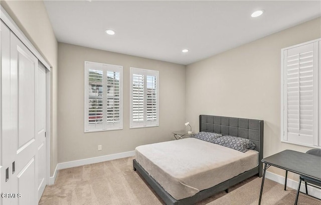 carpeted bedroom with a closet