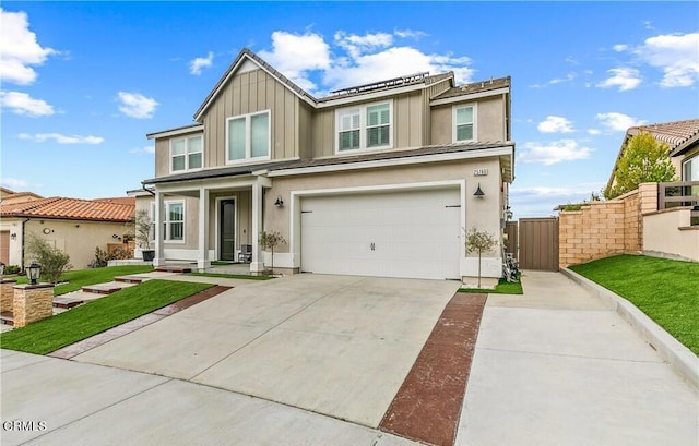 view of front of home with solar panels, a garage, and a front lawn