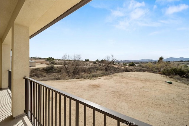 balcony featuring a mountain view