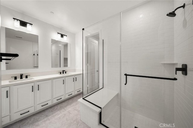 bathroom with double vanity, a sink, and a shower stall