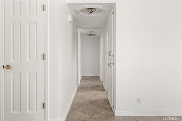 hallway with light tile patterned floors