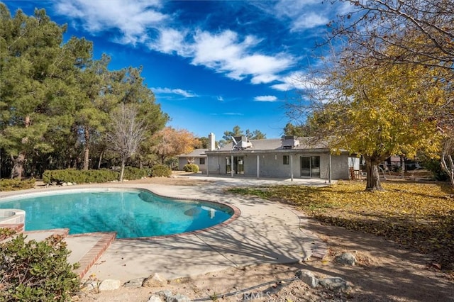 view of pool featuring a patio area