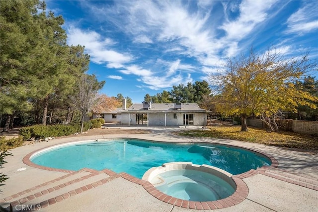 view of pool featuring an in ground hot tub and a patio area