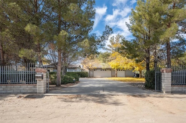 view of gate with a garage