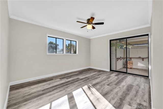 spare room with ceiling fan, light hardwood / wood-style flooring, and ornamental molding