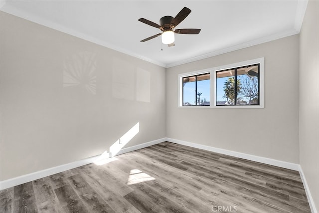 unfurnished room featuring ceiling fan, wood-type flooring, and ornamental molding