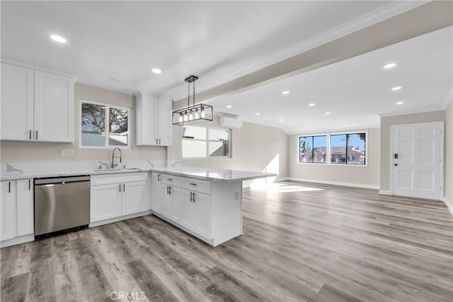 kitchen featuring a healthy amount of sunlight, white cabinets, and stainless steel dishwasher