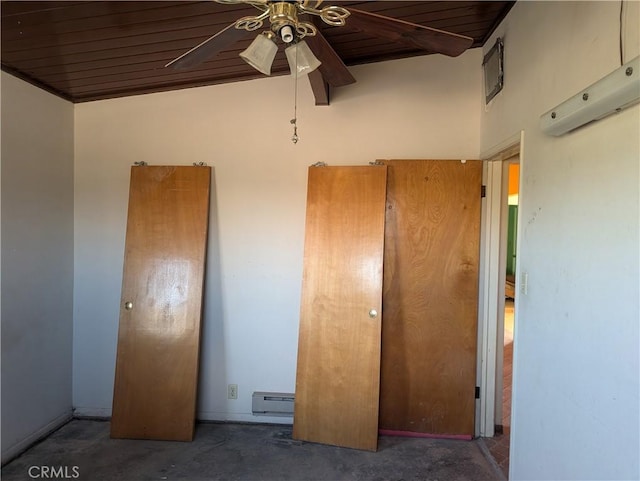 unfurnished bedroom featuring ceiling fan, wooden ceiling, and a baseboard heating unit