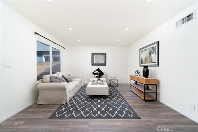 living room featuring dark hardwood / wood-style flooring