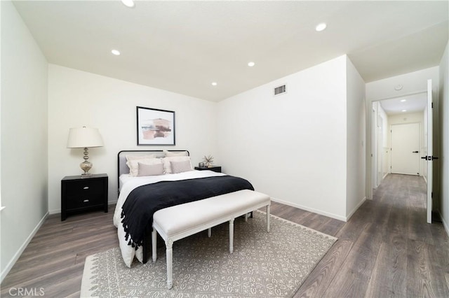 bedroom featuring dark hardwood / wood-style floors