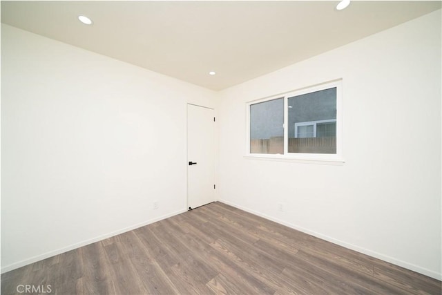 empty room featuring dark hardwood / wood-style floors