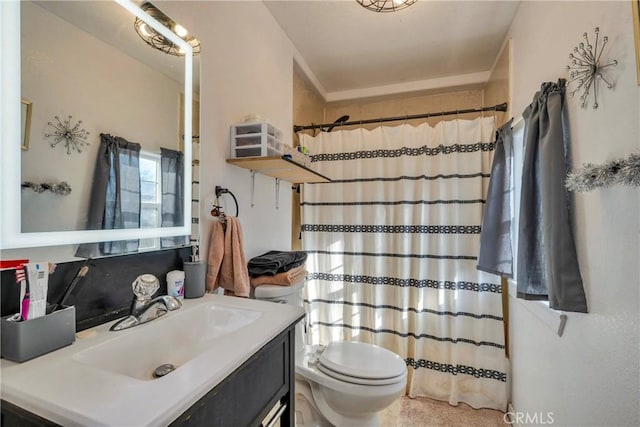 bathroom featuring a shower with curtain, vanity, and toilet