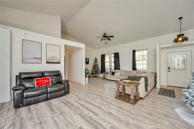 living room featuring vaulted ceiling, ceiling fan, and light hardwood / wood-style floors