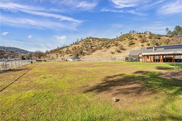 view of yard featuring a rural view and a mountain view