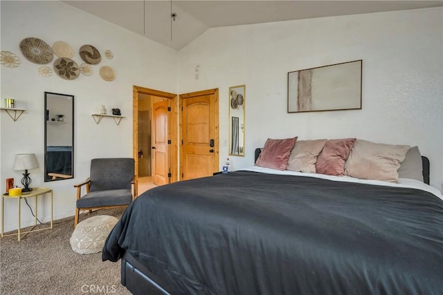 carpeted bedroom with lofted ceiling