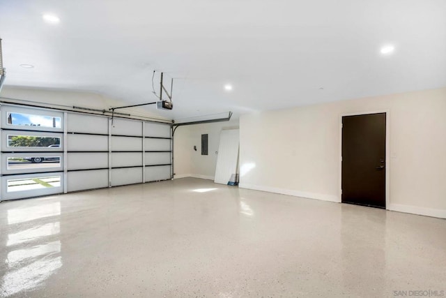 garage featuring electric panel and a garage door opener