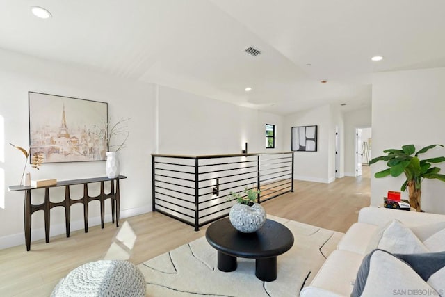 living room with light hardwood / wood-style flooring