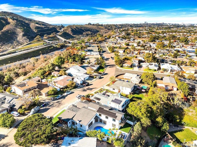 birds eye view of property with a mountain view