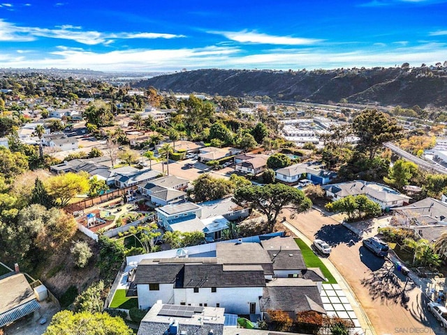 birds eye view of property featuring a mountain view