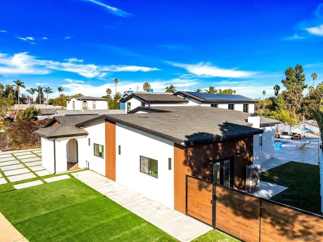 back of house featuring a yard