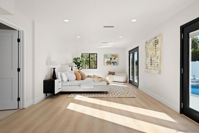 interior space featuring light hardwood / wood-style floors and french doors