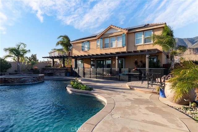 view of swimming pool featuring an in ground hot tub, a bar, and a patio