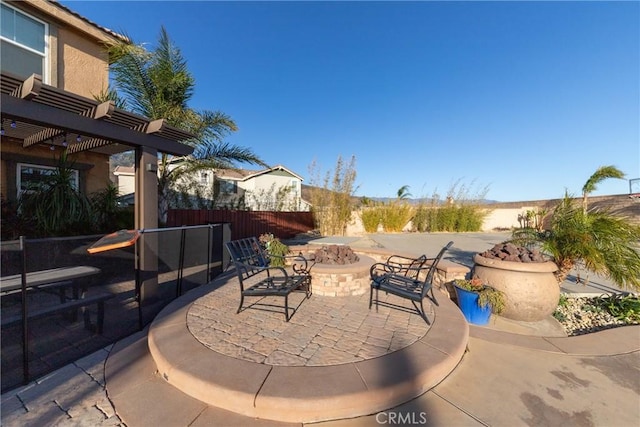 view of patio / terrace featuring an outdoor fire pit