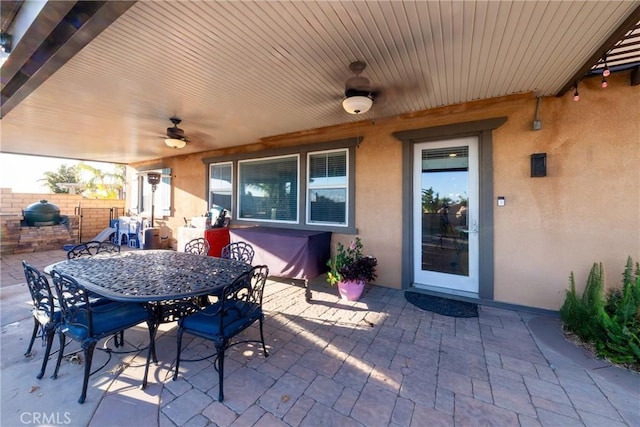 view of patio featuring ceiling fan