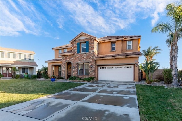 view of front of home featuring a front yard and a garage