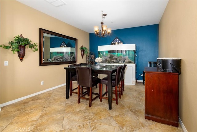 dining space with an inviting chandelier