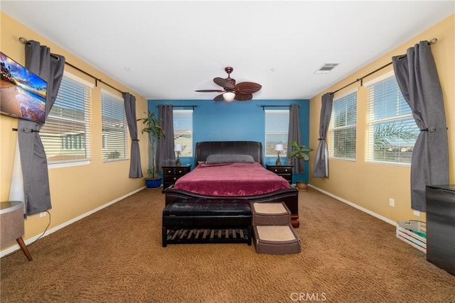 bedroom featuring ceiling fan and carpet