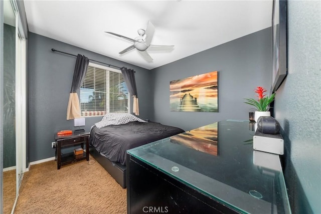 bedroom featuring ceiling fan and light colored carpet