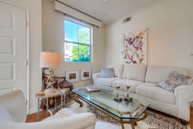 living room featuring crown molding