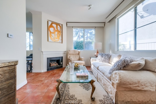 living room with a wealth of natural light and tile patterned flooring