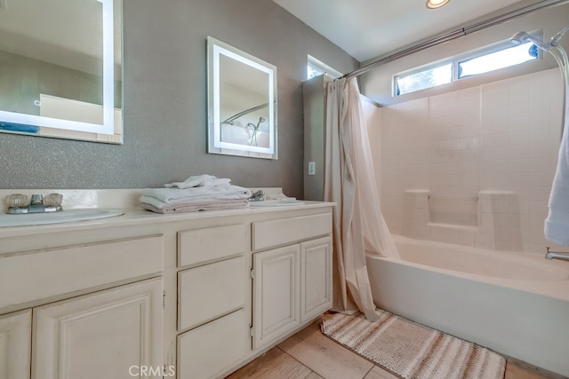 bathroom featuring vanity, tile patterned flooring, and shower / bathtub combination with curtain