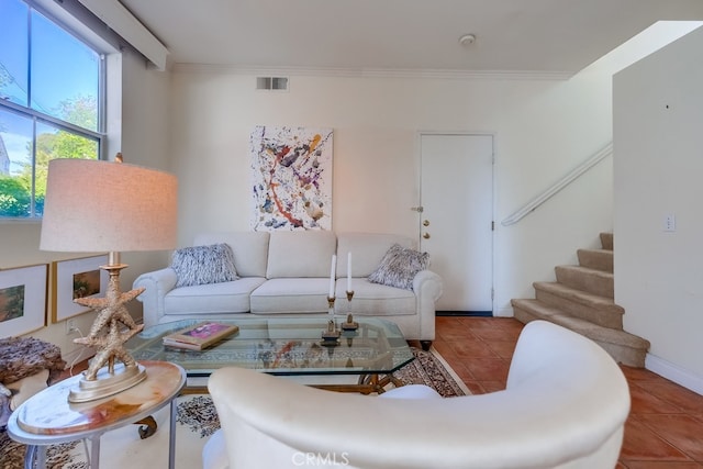 tiled living room featuring crown molding