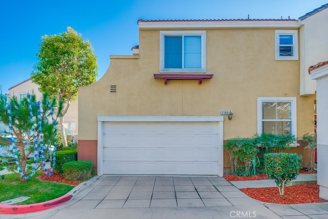 mediterranean / spanish-style house featuring a garage