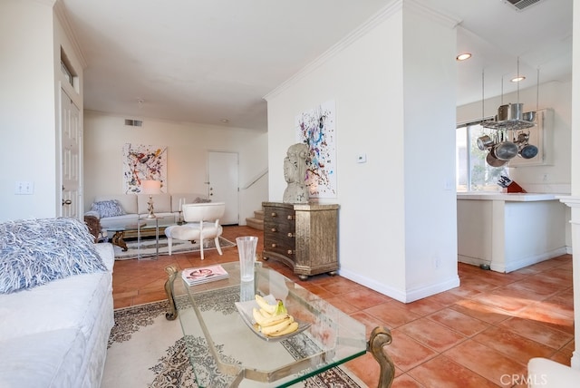 living room with tile patterned floors and ornamental molding