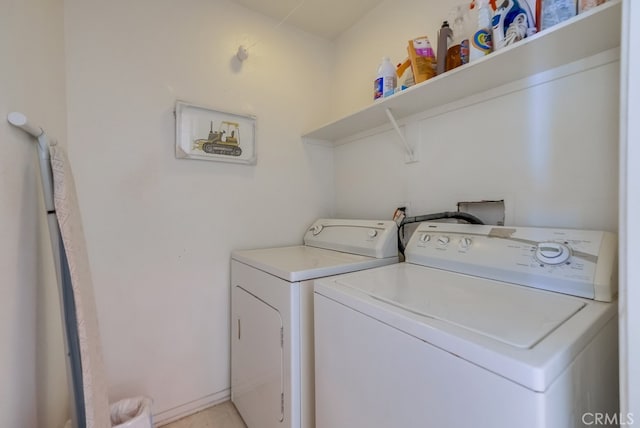 washroom featuring washing machine and dryer