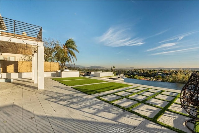 view of yard with an outdoor living space and a patio