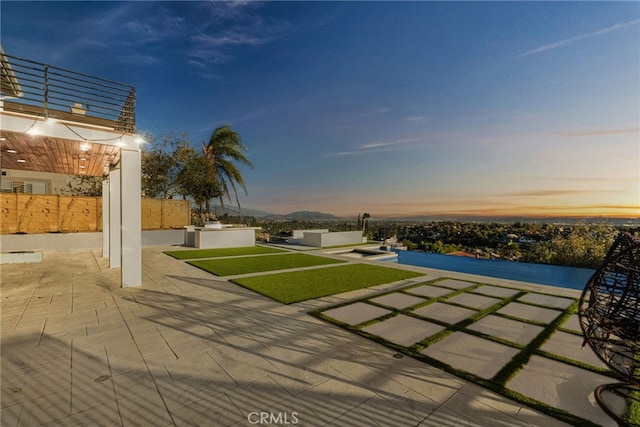 patio terrace at dusk with outdoor lounge area