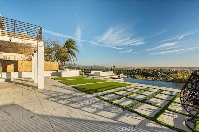 view of yard with an outdoor living space and a patio area