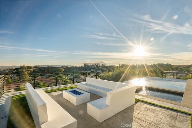 patio terrace at dusk with a fire pit