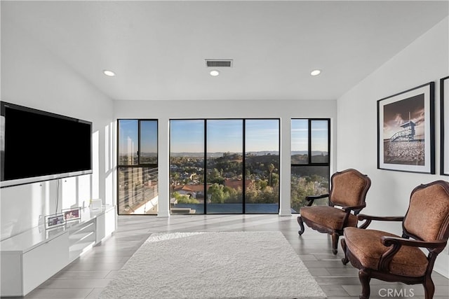 sitting room with recessed lighting and visible vents