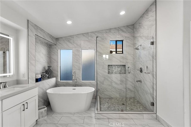 bathroom featuring vanity, separate shower and tub, and lofted ceiling