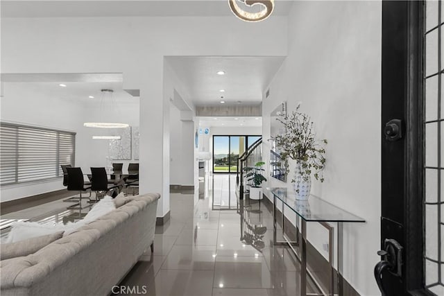 entryway with tile patterned flooring, baseboards, and recessed lighting